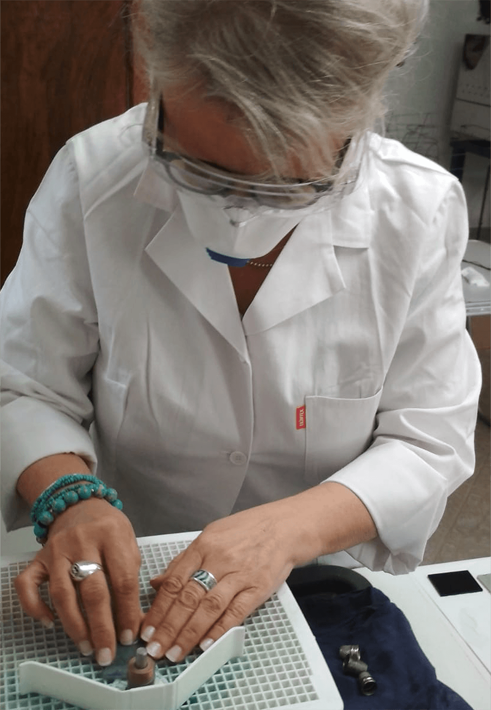 Person preparing glass